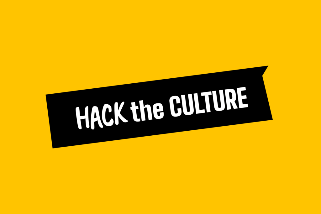 Bíle psané logo Hack the Culture v černém rámu na žlutém pozadí.